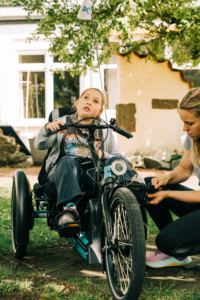 child on the recumbent bike
